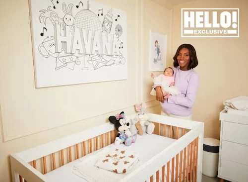 Chyna Mills poses with baby Havana in the nursery